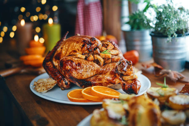 istock Preparing Stuffed Turkey for Holidays in Domestic Kitchen 1171137528