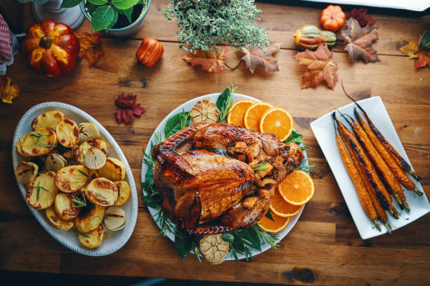 istock Preparing Stuffed Turkey for Holidays in Domestic Kitchen 1171137542