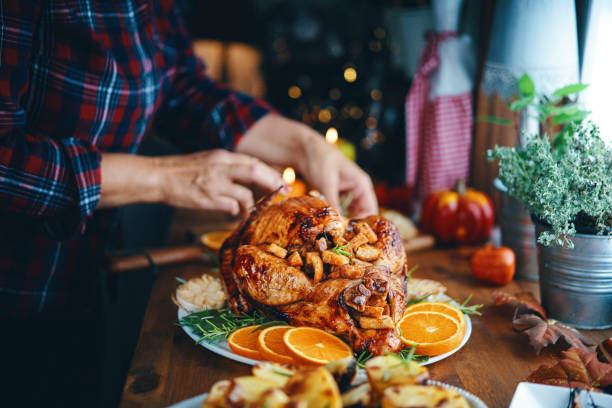 istock Preparing Stuffed Turkey for Holidays in Domestic Kitchen 1171137545