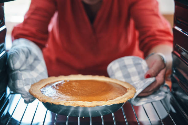 istock Baking Pumpkin Pie for the Holidays in the Oven 1171137550