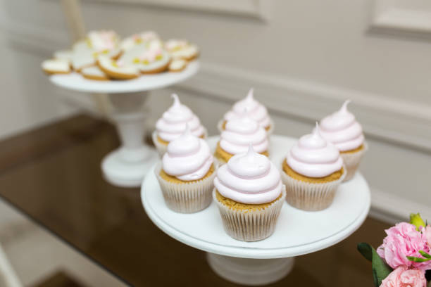 istock white plate with sweet muffins. wedding cupcakes 1171138096