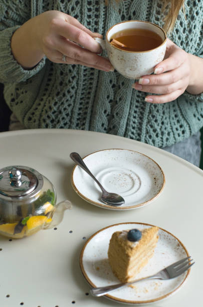 istock girl, cake and tea 1171139543