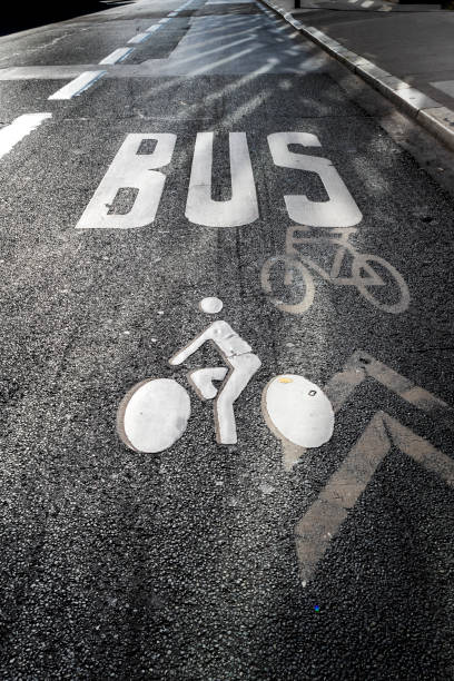 White bicycle road sign and bus sign  on asphalt lane