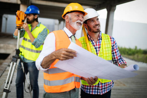 istock Team of business people in group, architect and engeneer on building site check documents 1171141476