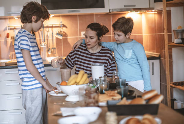 istock Happy family preparing breakfast together 1171141560