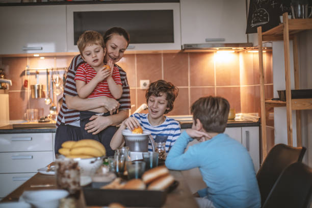 istock Happy family preparing breakfast together 1171141694