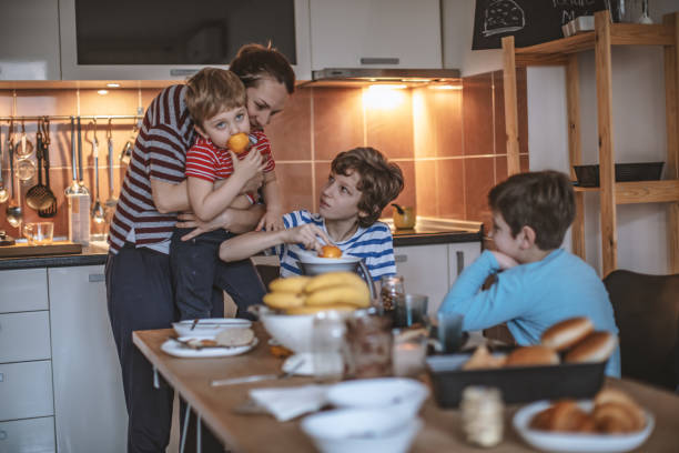 istock Happy family preparing breakfast together 1171141756