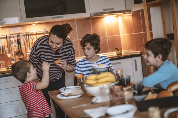 istock Happy family preparing breakfast together 1171142071