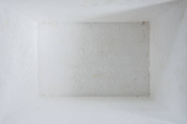 Footprints from workers shoes on the red brick dust after drilling in room  is inder construction, remodeling, renovation, overhaul, extension, restoration and reconstruction. Concept of  home improvement