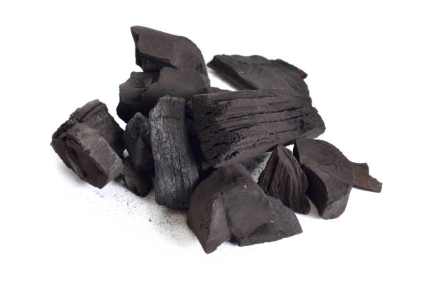 istock Pieces of charcoal isolated on white background 1171143339