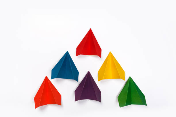 istock Color paper airplanes on white background. top view 1171144421
