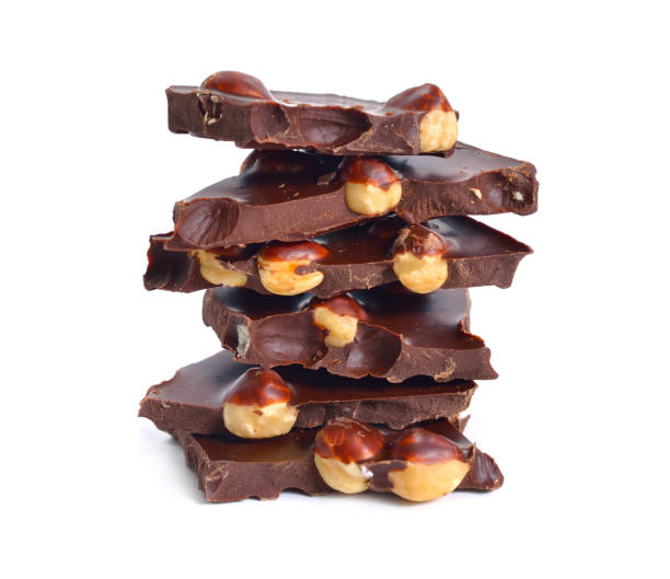 istock Dark chocolate with hazelnuts. Isolated on white background 1171144508