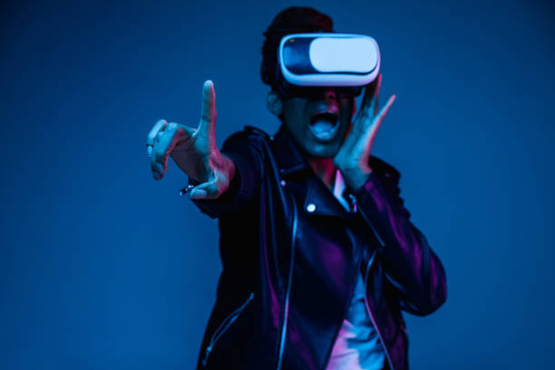 istock Young african-american woman's using VR-glasses in neon light 1171147542