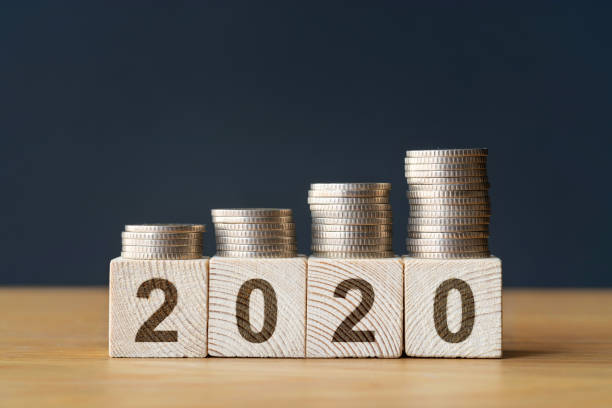 istock Money coins stack stair as step growing growth and wooden cube block 1171150431