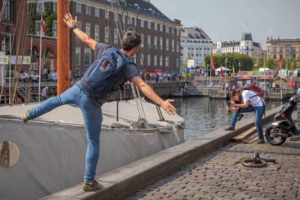 New Harbor, Copenhagen, Denmark - August 27, 2019: New Harbour is, despite the name, an old part of Copenhagen, which function like a museum for old sailing ships and a popular place for tourists.