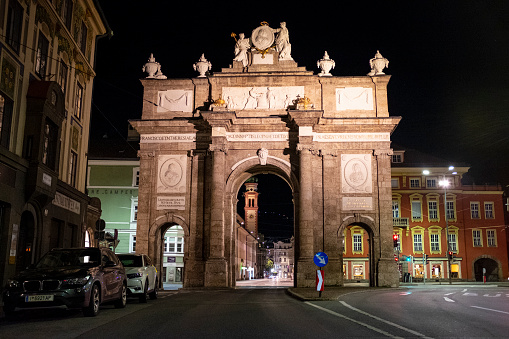 Night view of the Triumphal Arch of Innsbruck, at the end of Maria-Theresien Street. This Baroque-style monument, an imitation of those made in Ancient Rome, was commissioned by Empress Maria Teresa in the 18th century. It is currently one of the tourist attractions of the city.