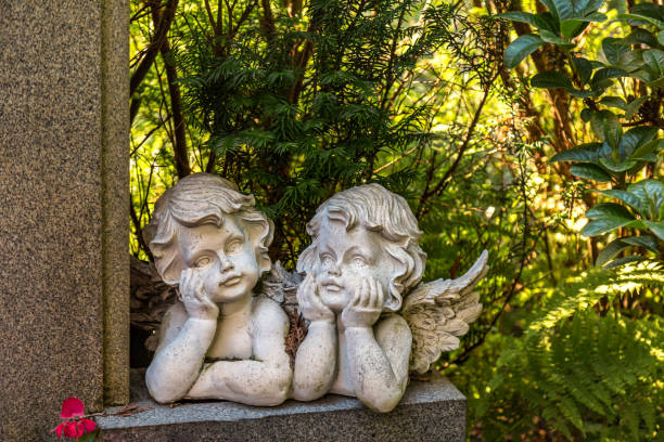 Thoughtful angel couple figures on a Stone wall