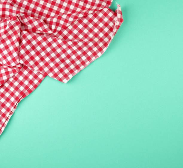 istock white red checkered kitchen towel on a green background 1171156546