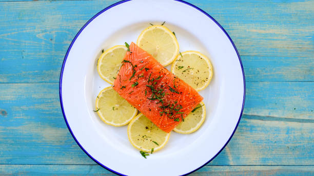 istock Organic Salmon Fillet On Lemon With Parsley 1171156577