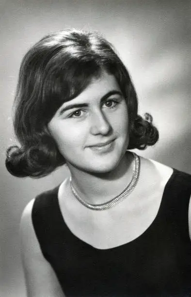 Photo of Vintage retro 1960s monochrome portrait of young woman/girl looking in camera