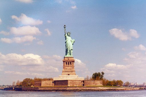 Vintage analog 1982 atmospheric view of the Statue of Liberty in New York, USA.