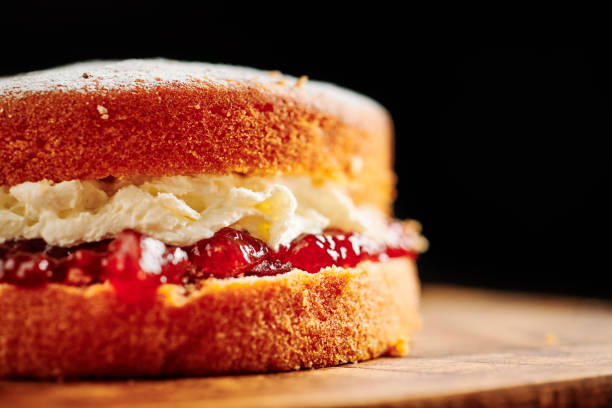 istock Whole Victoria sponge cake on a rustic chopping board. 1171160699