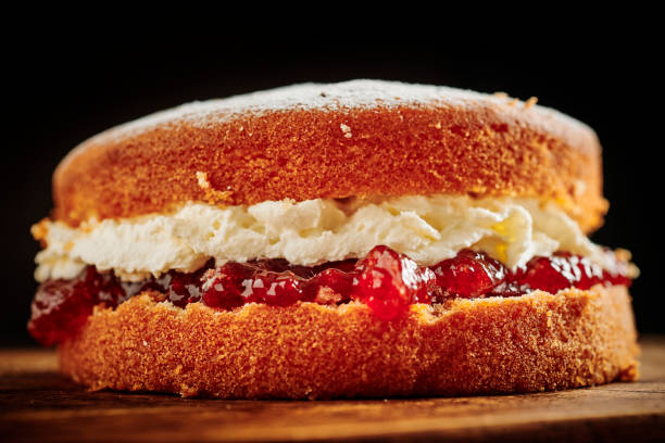 istock Whole Victoria sponge cake on a rustic chopping board. 1171160709