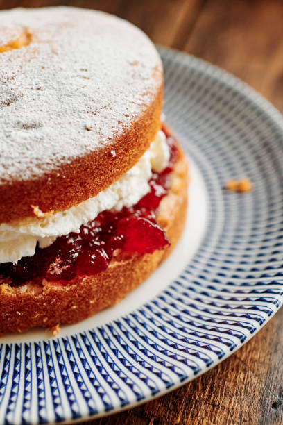 istock Whole Victoria sponge cake on a vintage palate. 1171160715