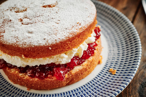 istock Whole Victoria sponge cake on a vintage palate. 1171160734