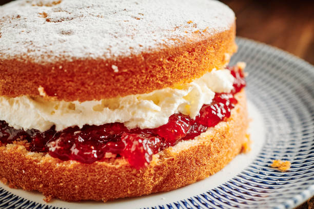 istock Whole Victoria sponge cake on a vintage palate. 1171160742