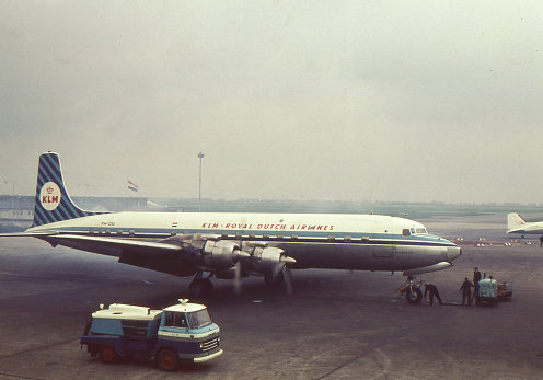 SCHIPHOL, THE NETHERLANDS, CA. 1964. View of A KLM Airlines Douglas DC-6 aircraft on the tarmac of Schiphol airport, ready for take off.