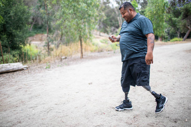 A male Hispanic man who has had both legs amputated.