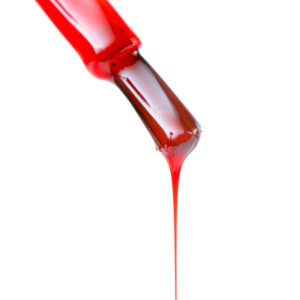 istock Red Nail Polish on White Background 1171168830