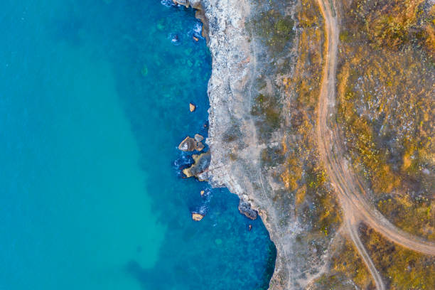 istock Aerial top-down view of a rocky seashore 1171170078