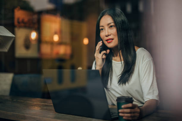istock Young woman working on laptop in cafe 1171170189