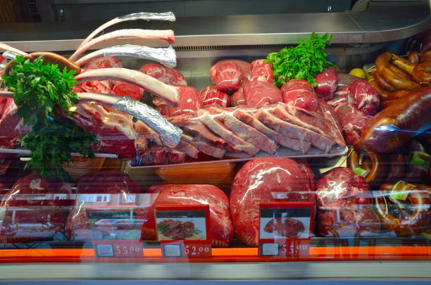 istock Showcase with raw meat in butcher shop. 1171170302