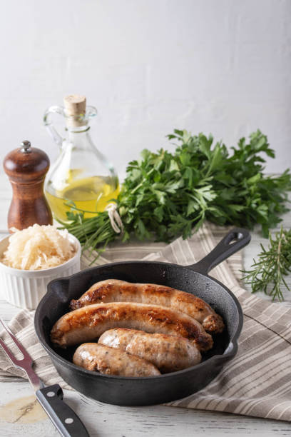 istock grilled italian german sausage on cast iron pan 1171174507