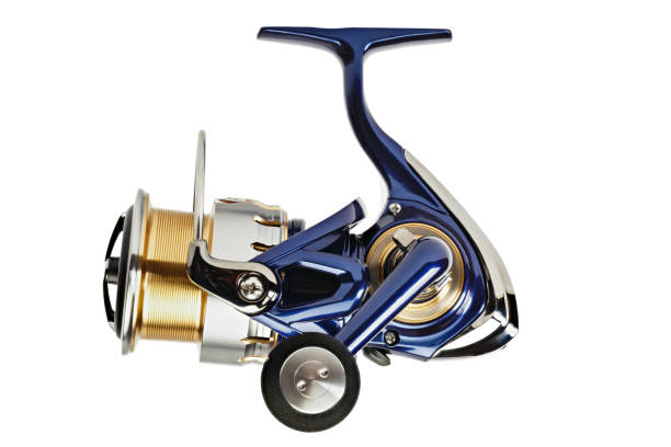 spinning fishing reel isolated on a white background. stock photo