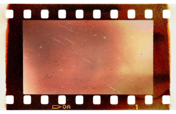 burned or burnt 35mm filmstrip or film material on white background stock photo