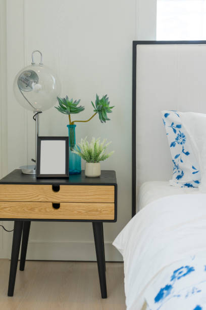 istock Yellow and blue pillows on white bed at home. 1171177690