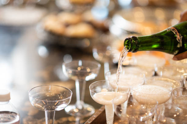 Champagne pouring Pouring champagne for celebration evening ball stock pictures, royalty-free photos & images