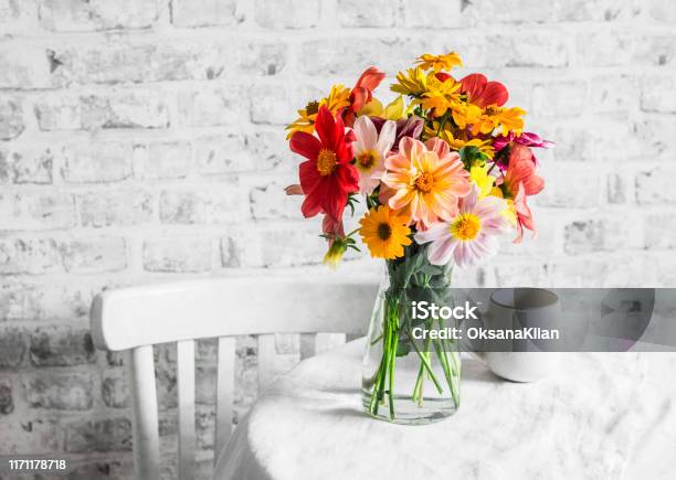 Bouquet Of Bright Colorful Autumn Flowers On A Bright Table In A Cozy Light Kitchen Copy Space Flat Lay Stock Photo - Download Image Now