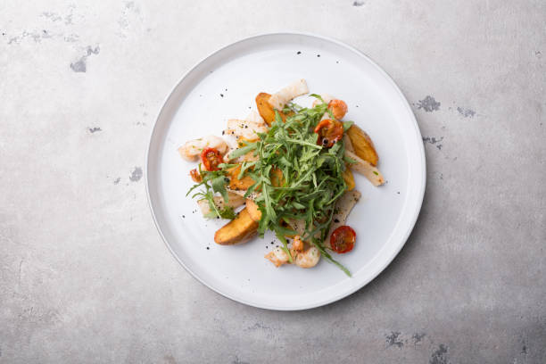 istock Seafood salad with green arugula 1171179847