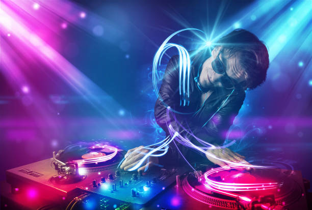 istock Energetic Dj mixing music with powerful light effects 1171180177