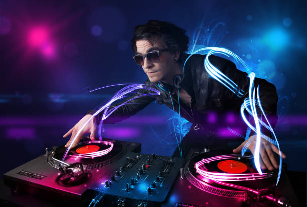 istock Disc jockey playing music with electro light effects and lights 1171180701