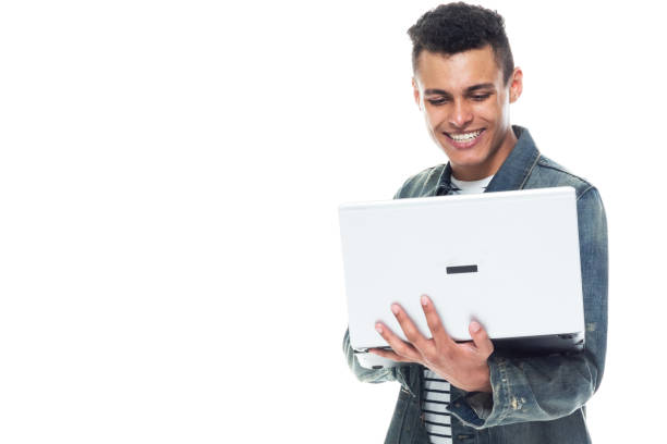 istock Good looking tall black man wearing denim jacket - using a laptop 1171181335