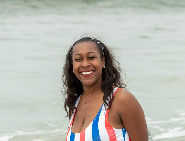 istock Black Woman Smiling at the Beach 1171182147