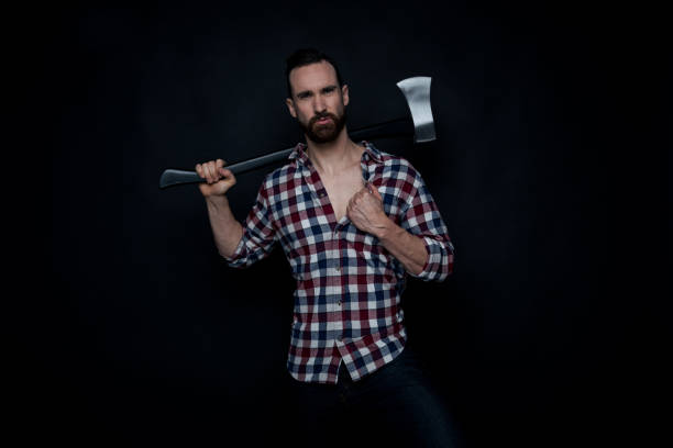 istock Attractive lumberjack man holding an axe 1171182329