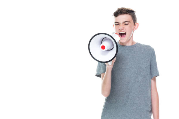 istock Young 13 year old teenage male - using a megaphone 1171183363