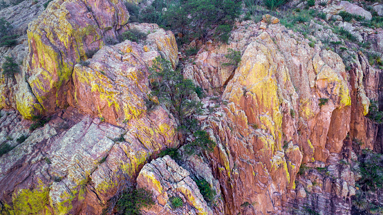 Aerial view of a canyon wall with green lichen in Cave Creek, Chiricahua Mountains, Arizona.